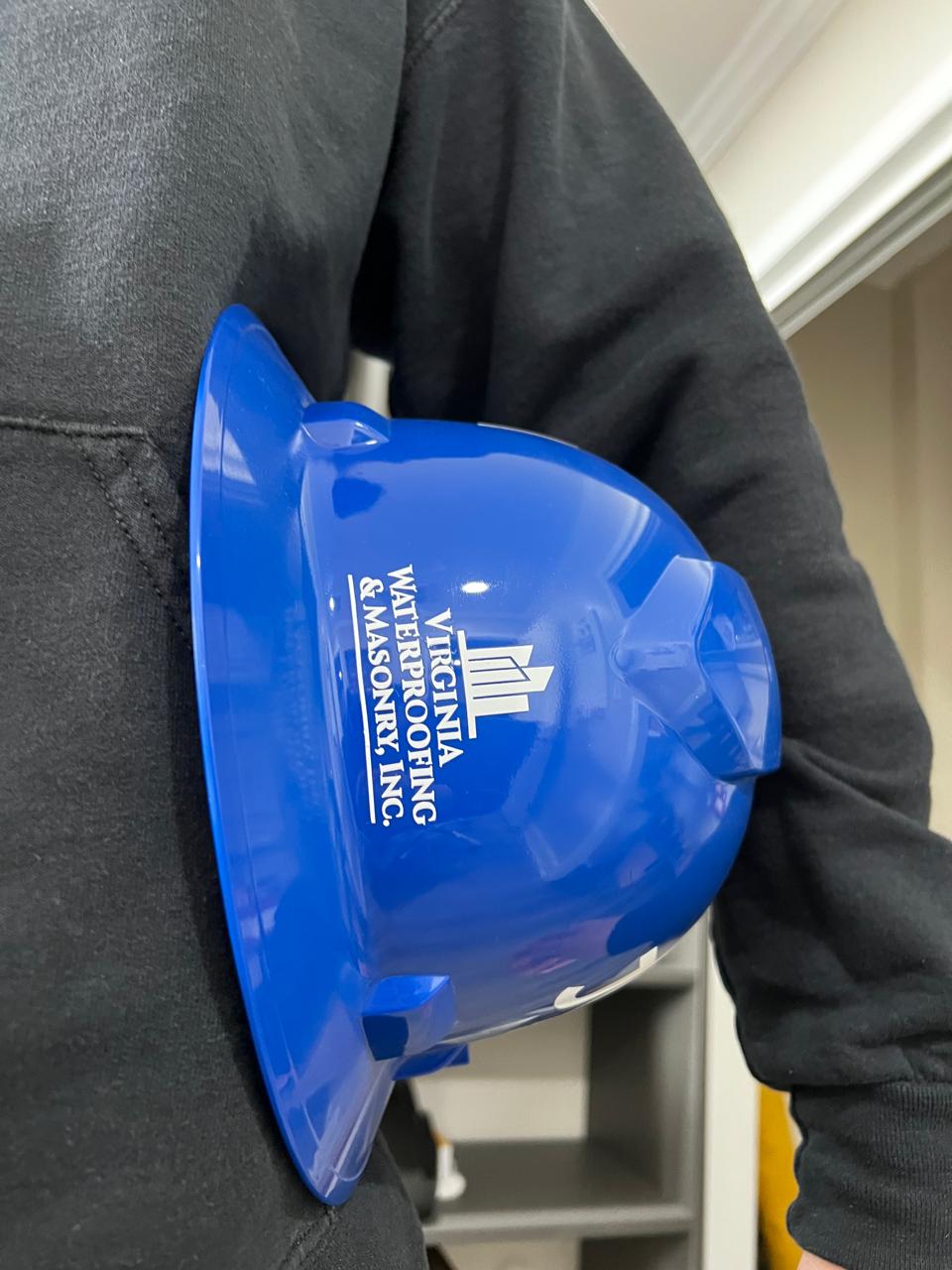 VWMI branded hard hat representing the company's OSHA safety standard